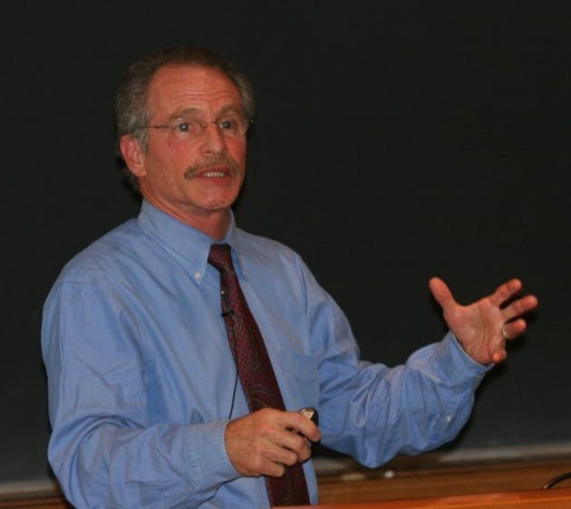Harvard Medical School's Paul Epstein, a public health and climate change expert, links global warming and disease in Filene Auditorium Thursday.