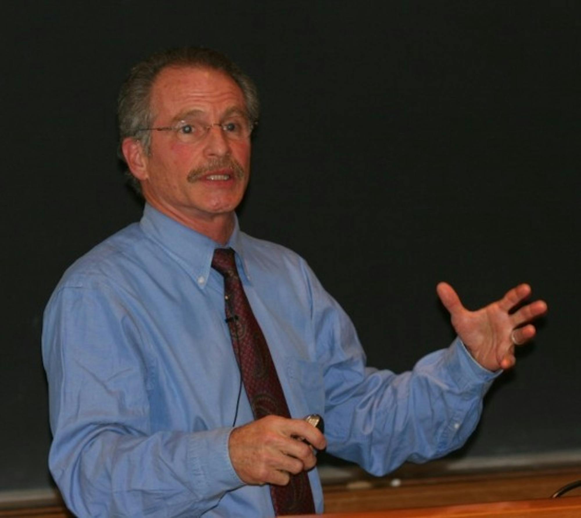 Harvard Medical School's Paul Epstein, a public health and climate change expert, links global warming and disease in Filene Auditorium Thursday.