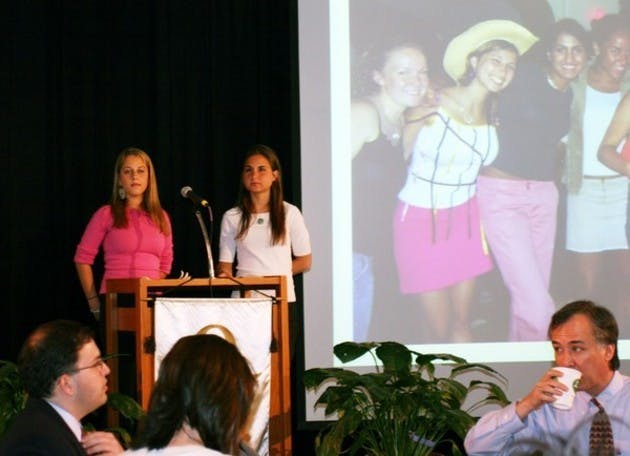 Ali Levine '07 and Jessica Magidson '06 present the Order of Omega Awards on Monday.