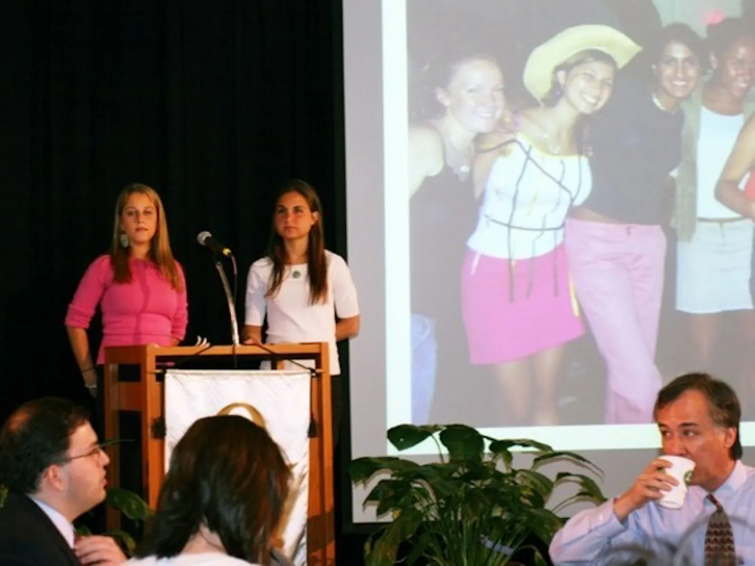 Ali Levine '07 and Jessica Magidson '06 present the Order of Omega Awards on Monday.