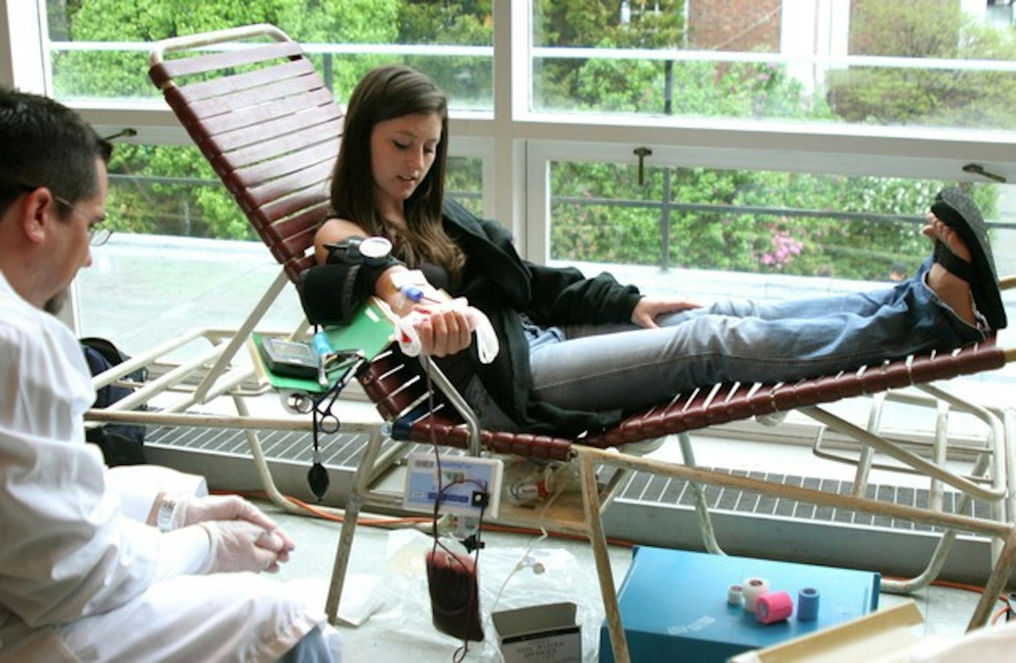 Susanah Heohn '10 donates blood for the first time, inspired to give by the blood shortage in national and regional blood banks.