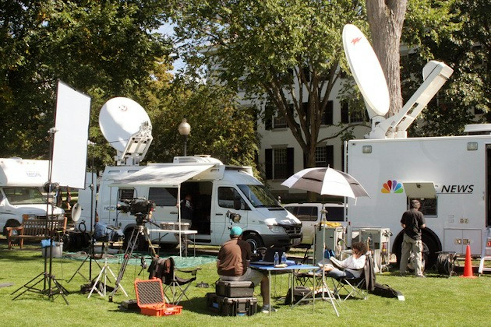 Media trucks line the east side of the Green Tuesday in preparation for Wednesday's presidential debate.