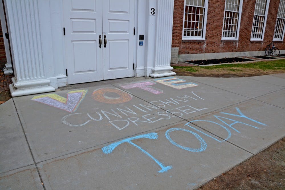 Student candidates chalked campaign slogans around campus over the weekend. 