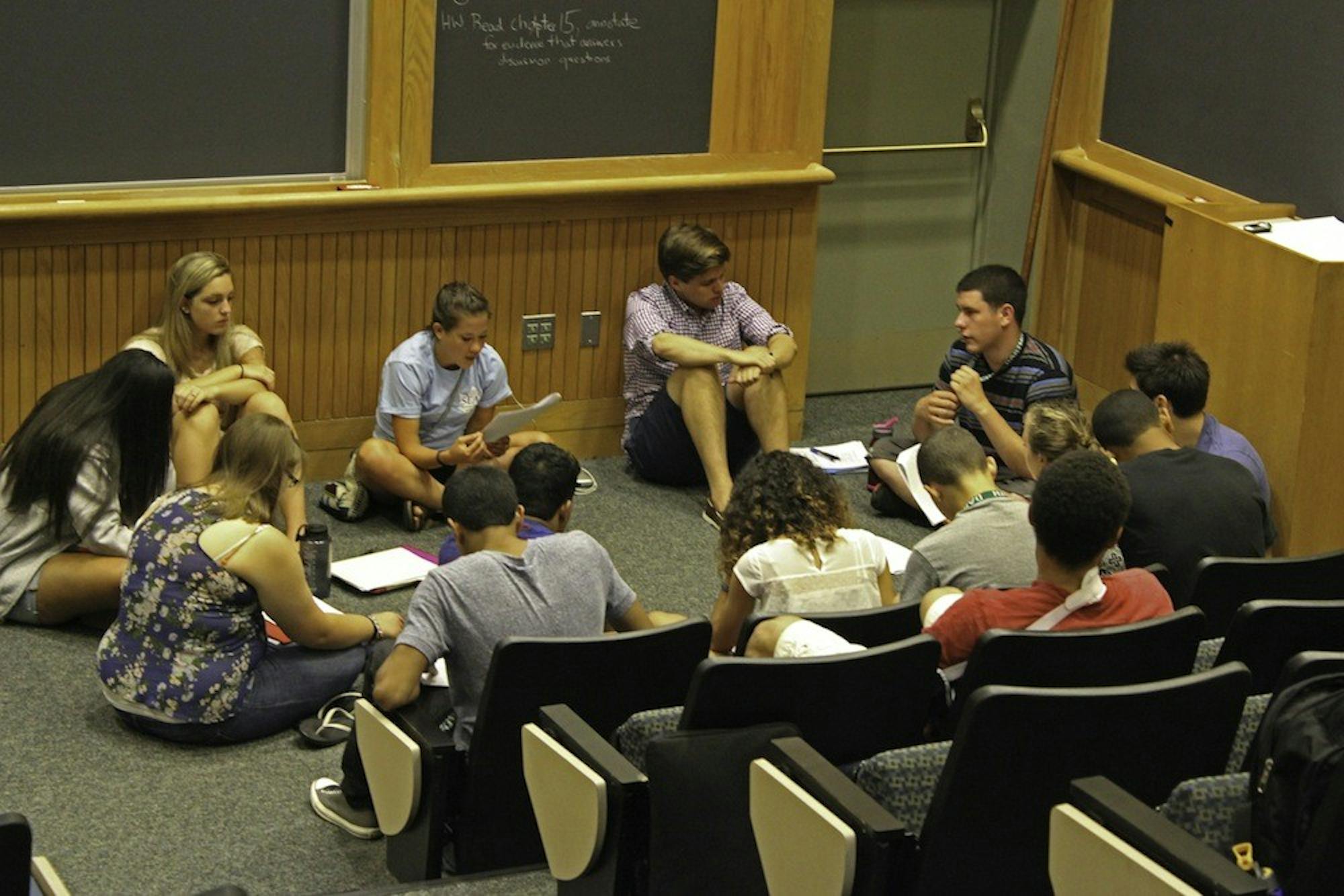 SEAD participants discuss a reading in Rocky 003 for a humanities class Thursday morning. 