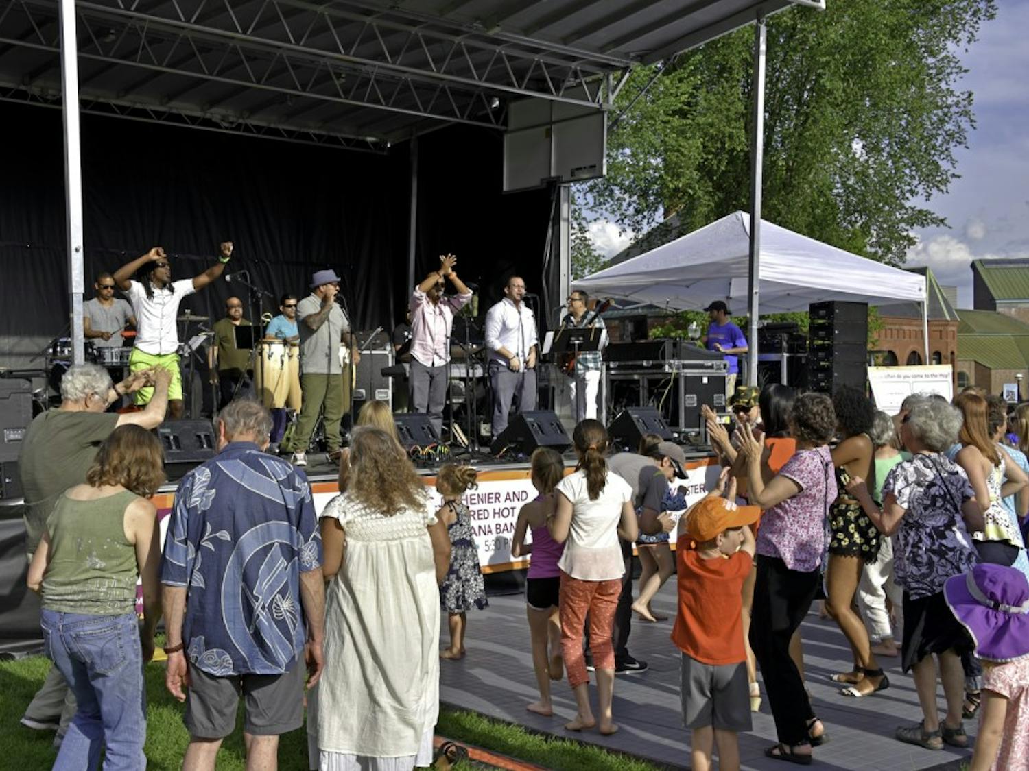 Plena Libre performs to a full Green in a free concert.