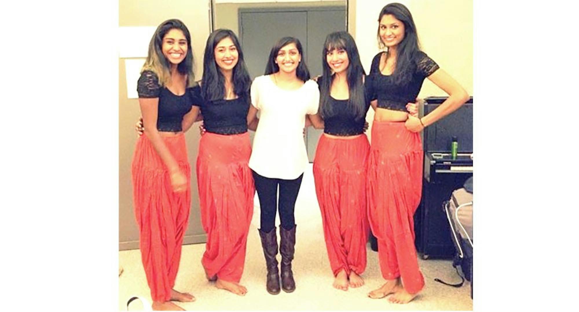 Navi Nagaraj '16, middle, stands with her fellow Raaz dancers, in costume.