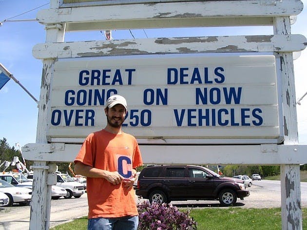 Benjamin Herson '02 and Jeff Deck '02 travel the nation editing typos on signs and billboards.