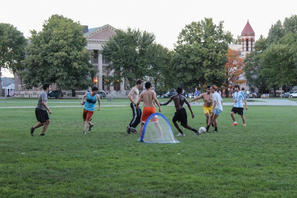Students play soccer on the green&nbsp;on Wednesday afternoon.