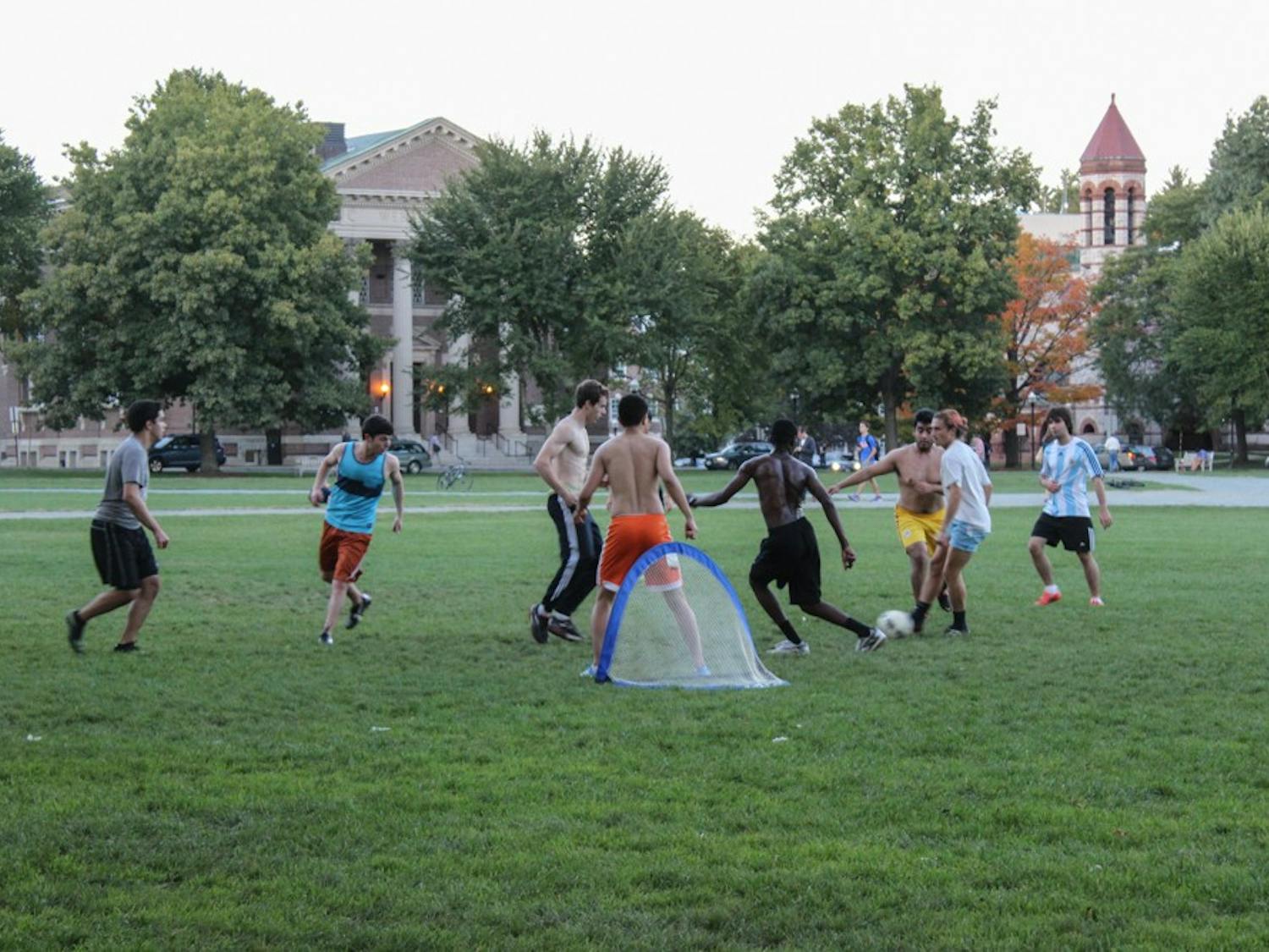 Students play soccer on the green&nbsp;on Wednesday afternoon.