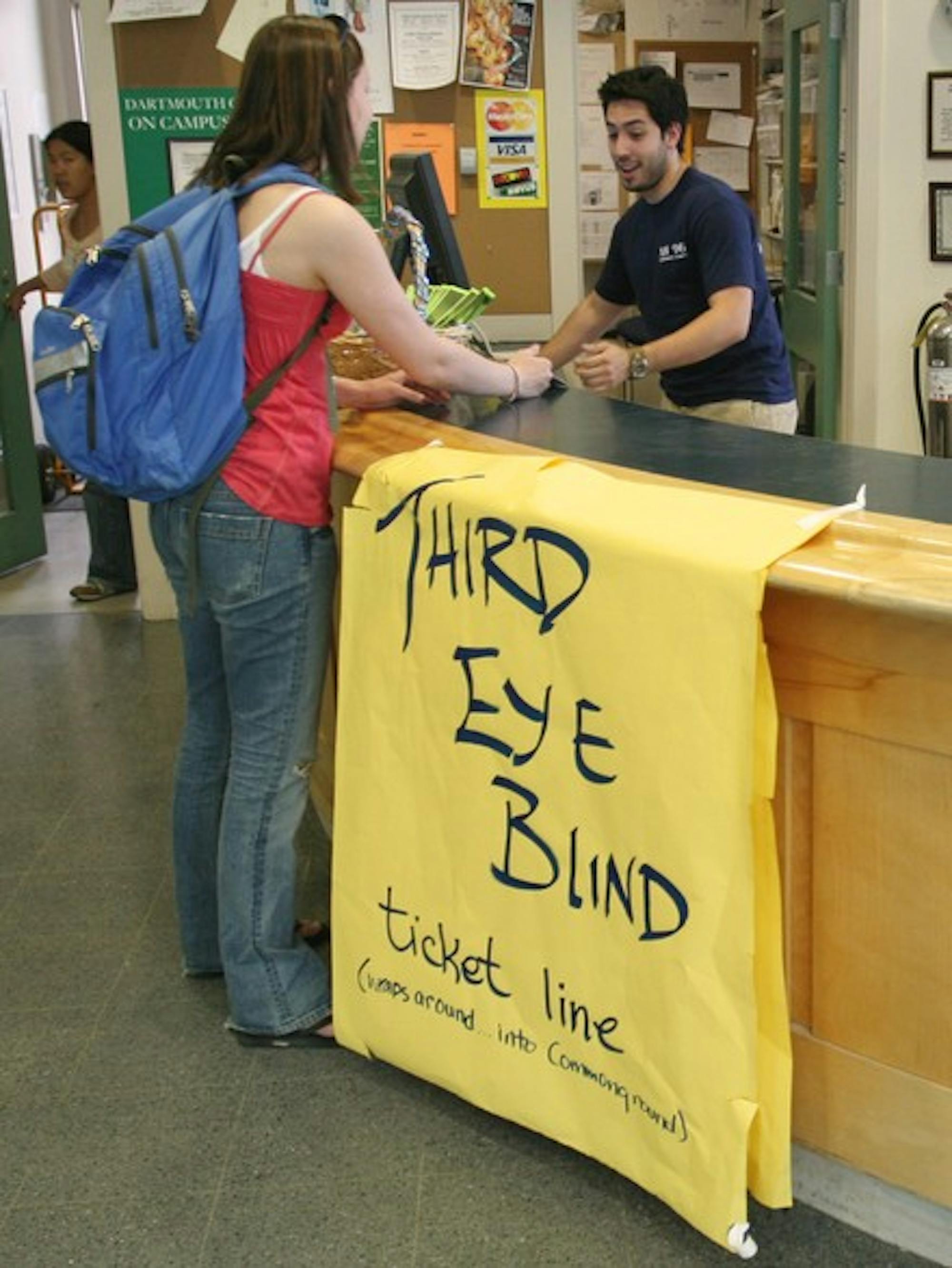Lauren Breach '09 buys her Third Eye Blind ticket at the Collis Info Desk. The concert has had a tough time selling its tickets at $20 a pop.