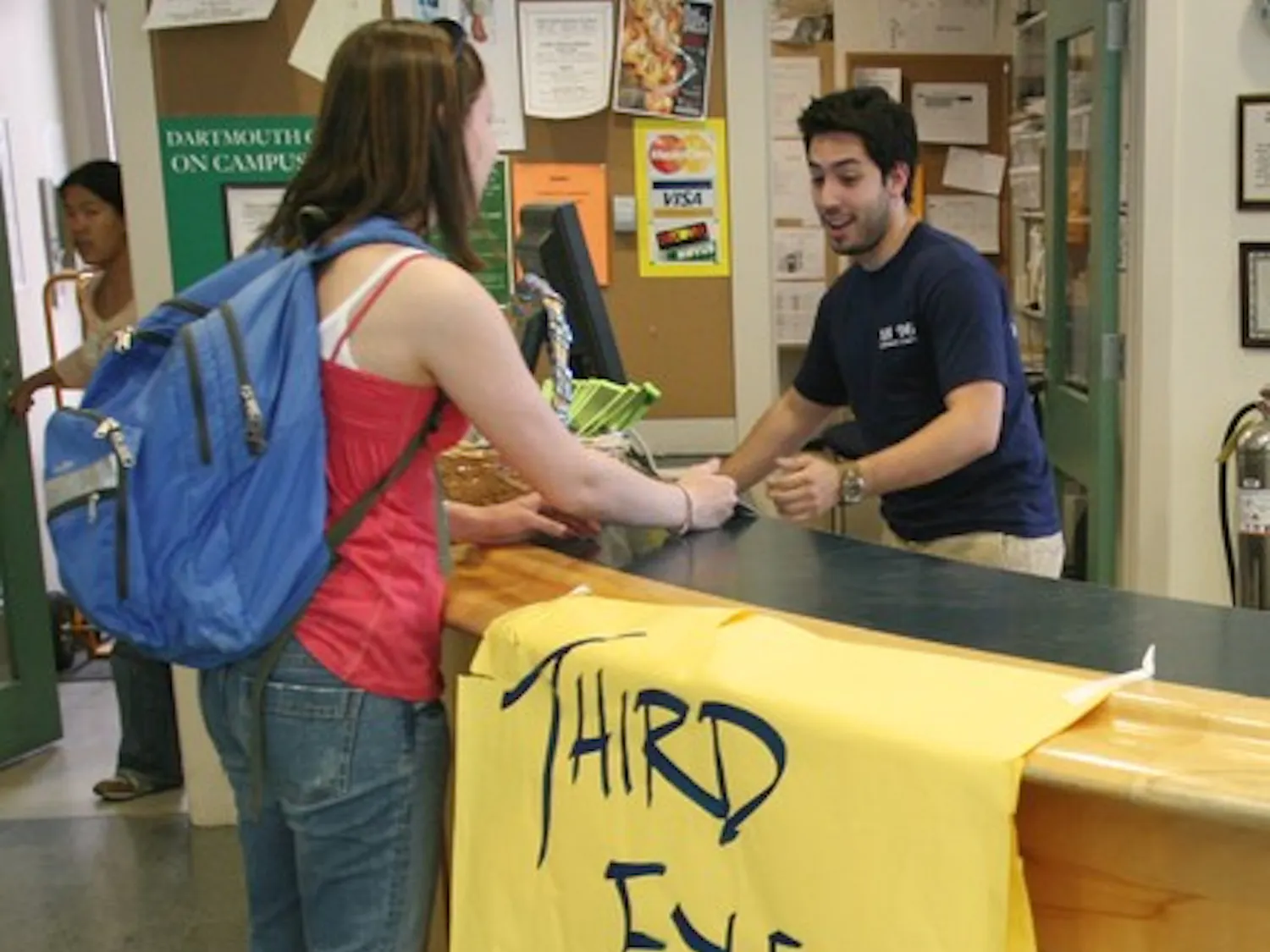 Lauren Breach '09 buys her Third Eye Blind ticket at the Collis Info Desk. The concert has had a tough time selling its tickets at $20 a pop.