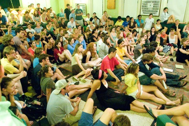Students crowd Gamma Delta Chi fraternity's chapter room Tuesday to discuss gender issues on campus.