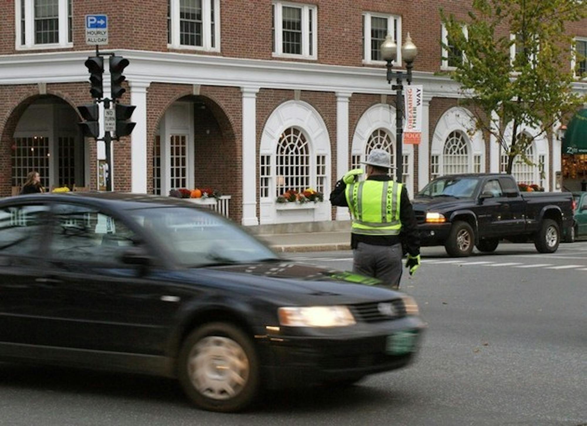 Hanover Police Officers direct traffic at the crosswalk of Main St. and Wheelock Rd. after the blackout.