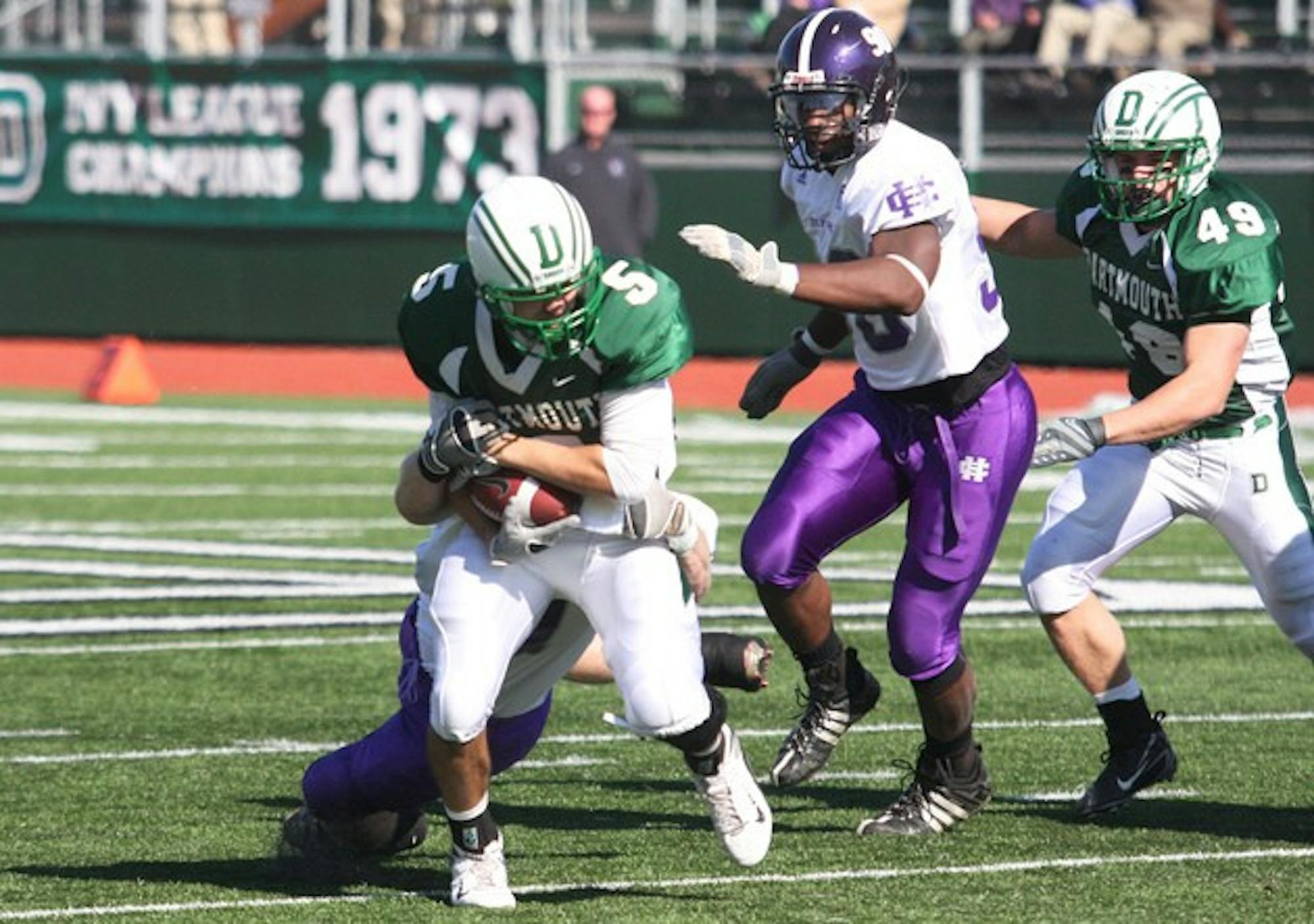 Quarterback Alex Jenny '10 fought off pressure from Holy Cross to pass for 232 yards and two TDs Saturday.