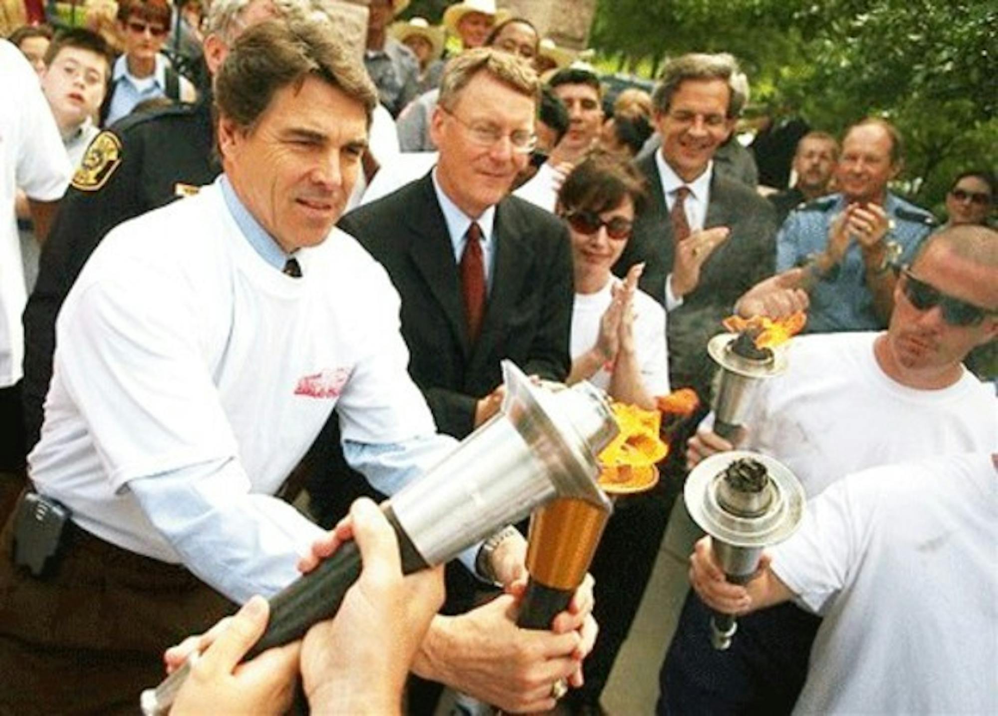 Texas Gov. Rick Perry lights a torch outside the Capitol on Monday to kick off the 2006 Special Olympics, a nationwide event coming to the Upper Valley.
