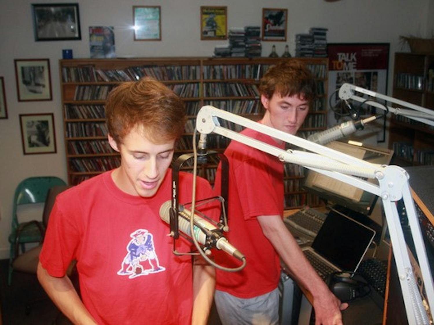 Shane O'Neal '14 and Gil Whalen '14, co-hosts for the Big Green Scene radio show, prepare their latest broadcast.