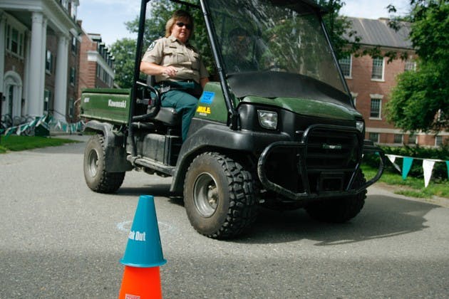 Onyinyechukwu Kanu '09 drives while wearing beer goggles through an obstacle course on Massachusetts Row during the DAPA sponsored event.