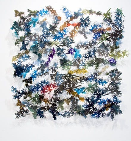 Julia Barello, one of two artists featured in the Spheris Gallery's current exhibit, creates wall-mounted installations from discarded MRIs and X-rays.