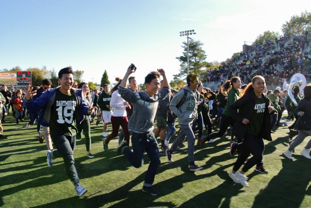 Members of the Class of 2019 rushed onto Memorial Field during the halftime period. 
