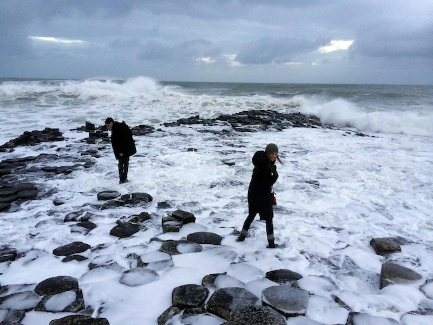 Students in Public Policy 85 take a dip at the Giant's Causeway in Northern Ireland