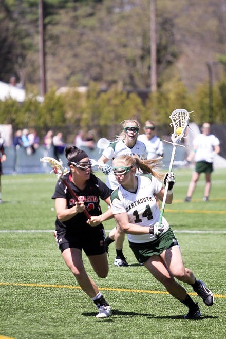 Dana Brisbane '12 was part of the Dartmouth defensive unit that held Cornell University to five goals below its season scoring average in the 12-10 win.