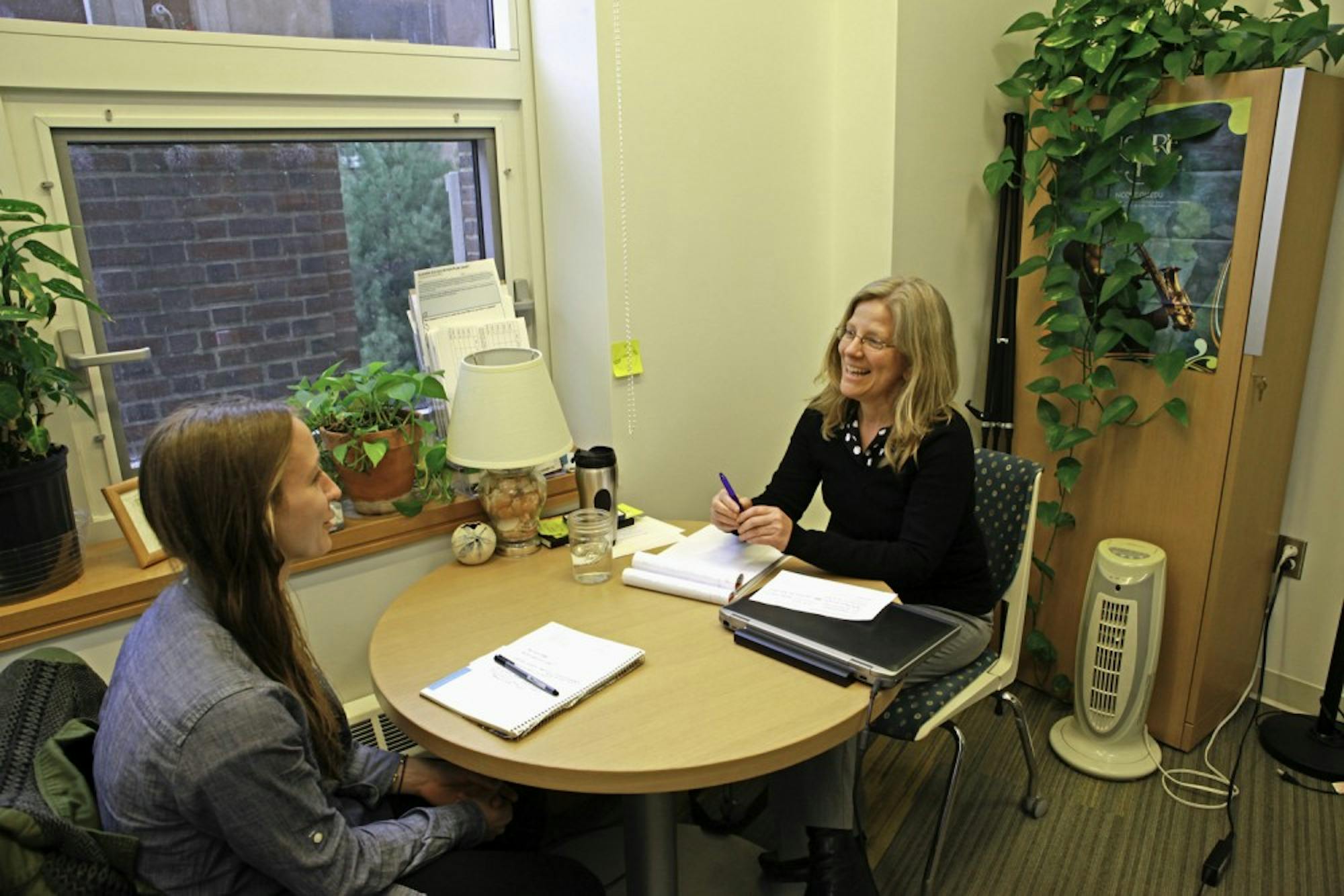 Pre-health advisor Sarah Berger meets with students to discuss academics and applications. 