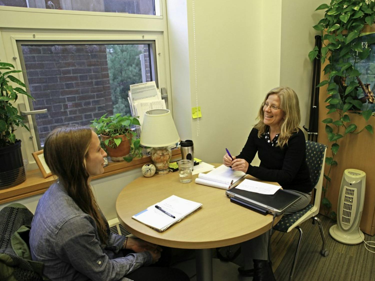 Pre-health advisor Sarah Berger meets with students to discuss academics and applications. 