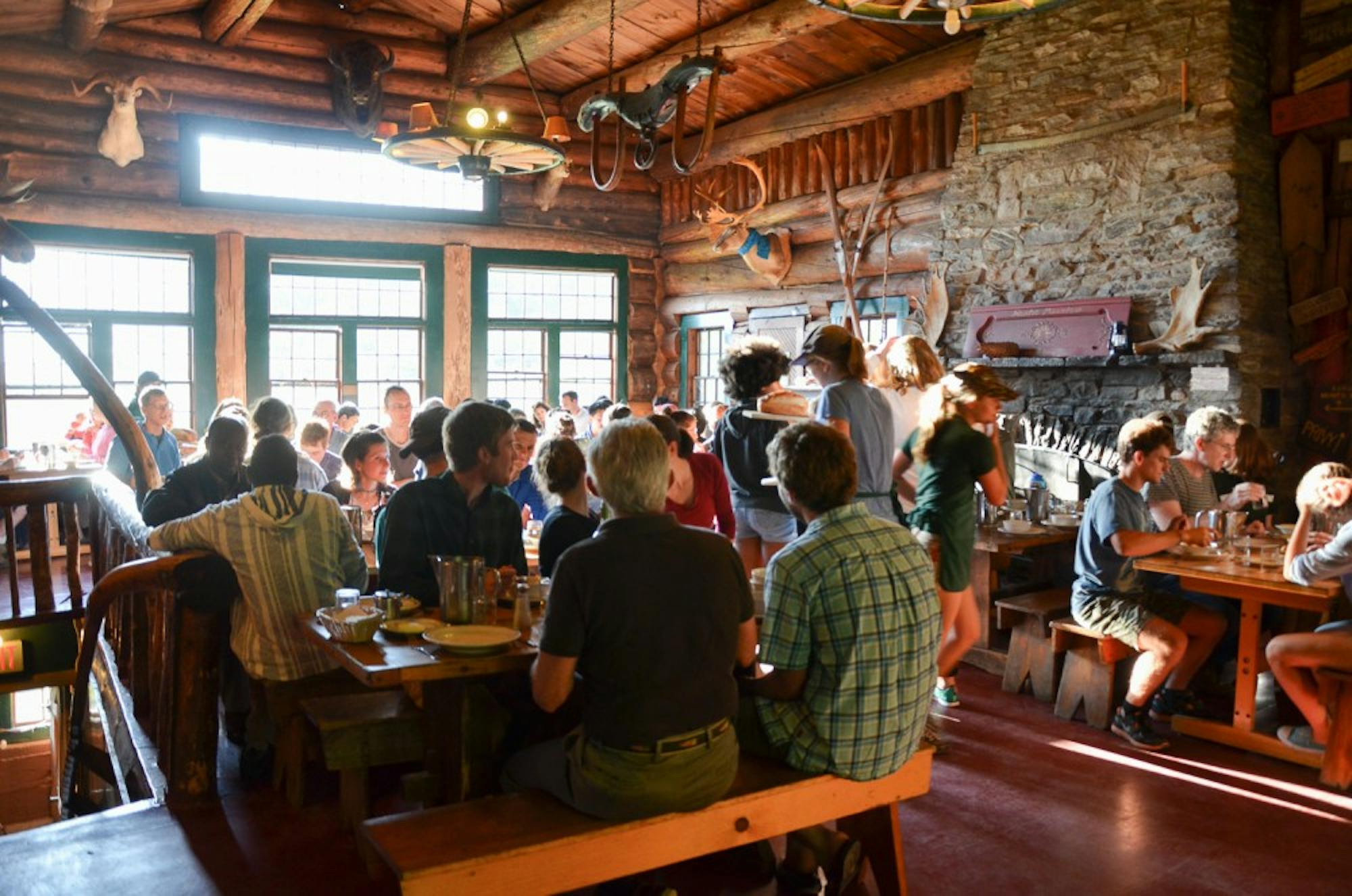 Visitors sit down for a meal at the current Moosilauke Ravine Lodge, which will be rebuilt starting this fall.