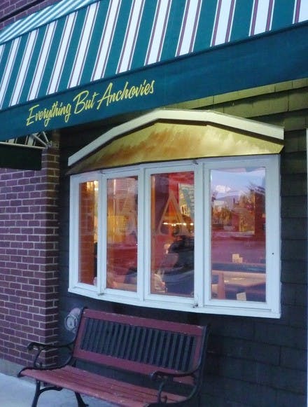 My friends and I slipped into a booth in the back and ordered away: pizza, chicken fingers, sweet potato fries and free water. I was stupefied to find that other students actually went to the physical location. How was this my first time here? 