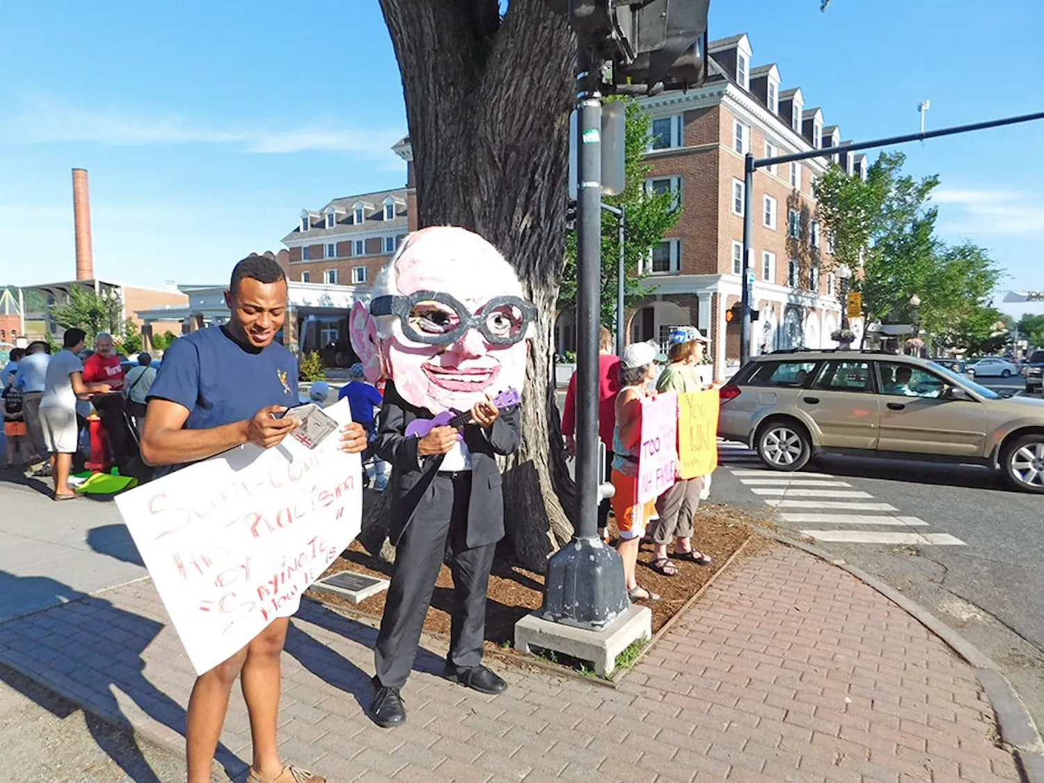 Students and community members gather on the corner of the Green to protest Donald Trump.