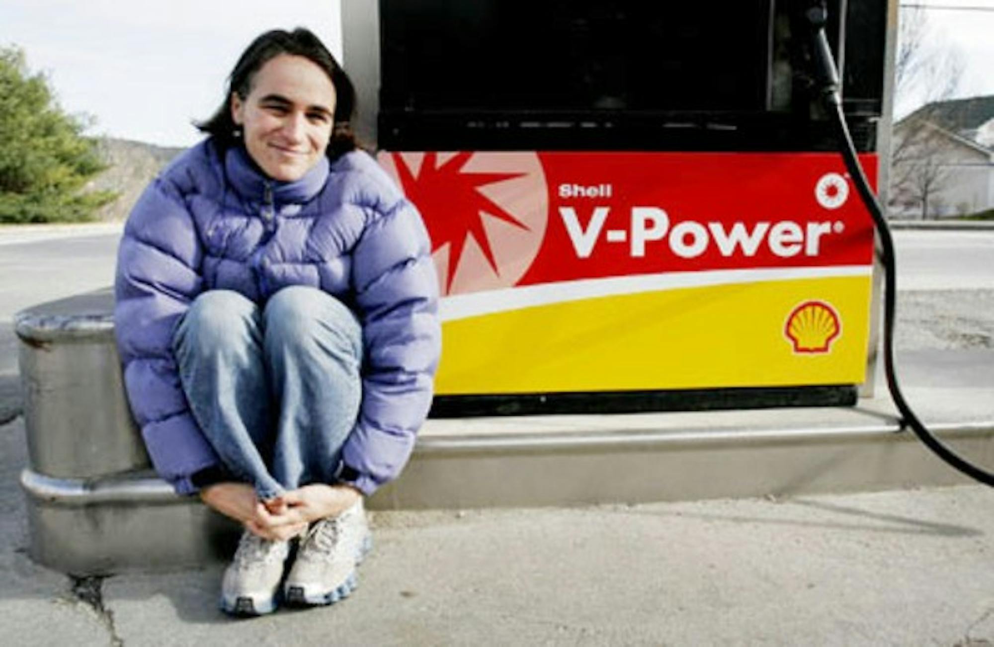 Cindy Pierce of Etna, N.H., poses for a photograph at a Lebanon, N.H., gas station on November 19, 2005. Pierce has been using her "V-Power" as fuel for her one-woman show, "Finding the Doorbell." (Geoff Hansen photograph)