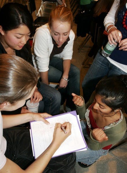 At room draw on Wednesday, freshmen Yoko Matsumoto, Virginia Deaton, Anna Dev and Courtney Valentine strategize to get their preferred rooms.
