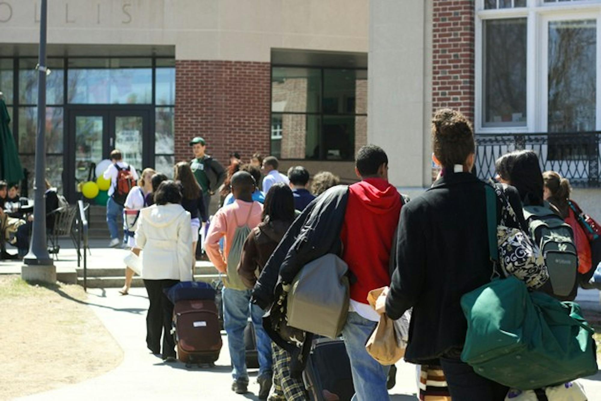 large group arrival (right off the bus) of prospective students walk to collis to check in and be placed with their hosts for the weekend