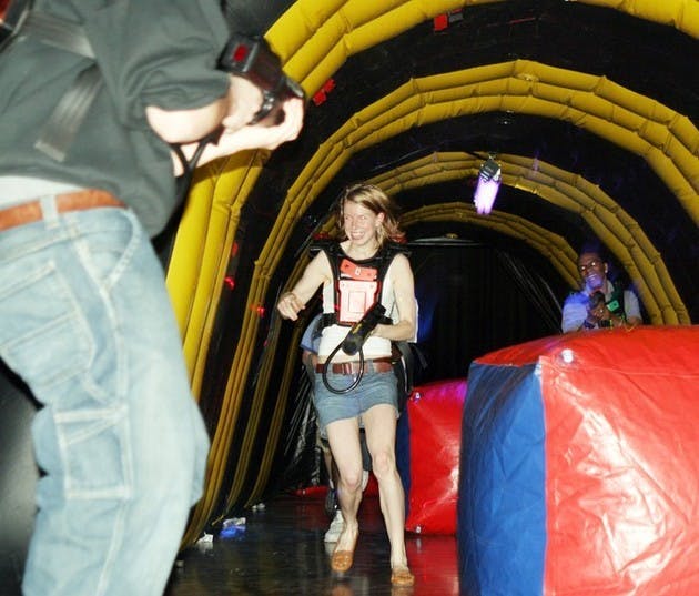 Jennifer Taylor '08 darts through a laser tag arena set up in Collis Commonground Saturday night. Lines could last 30 minutes long for the event.