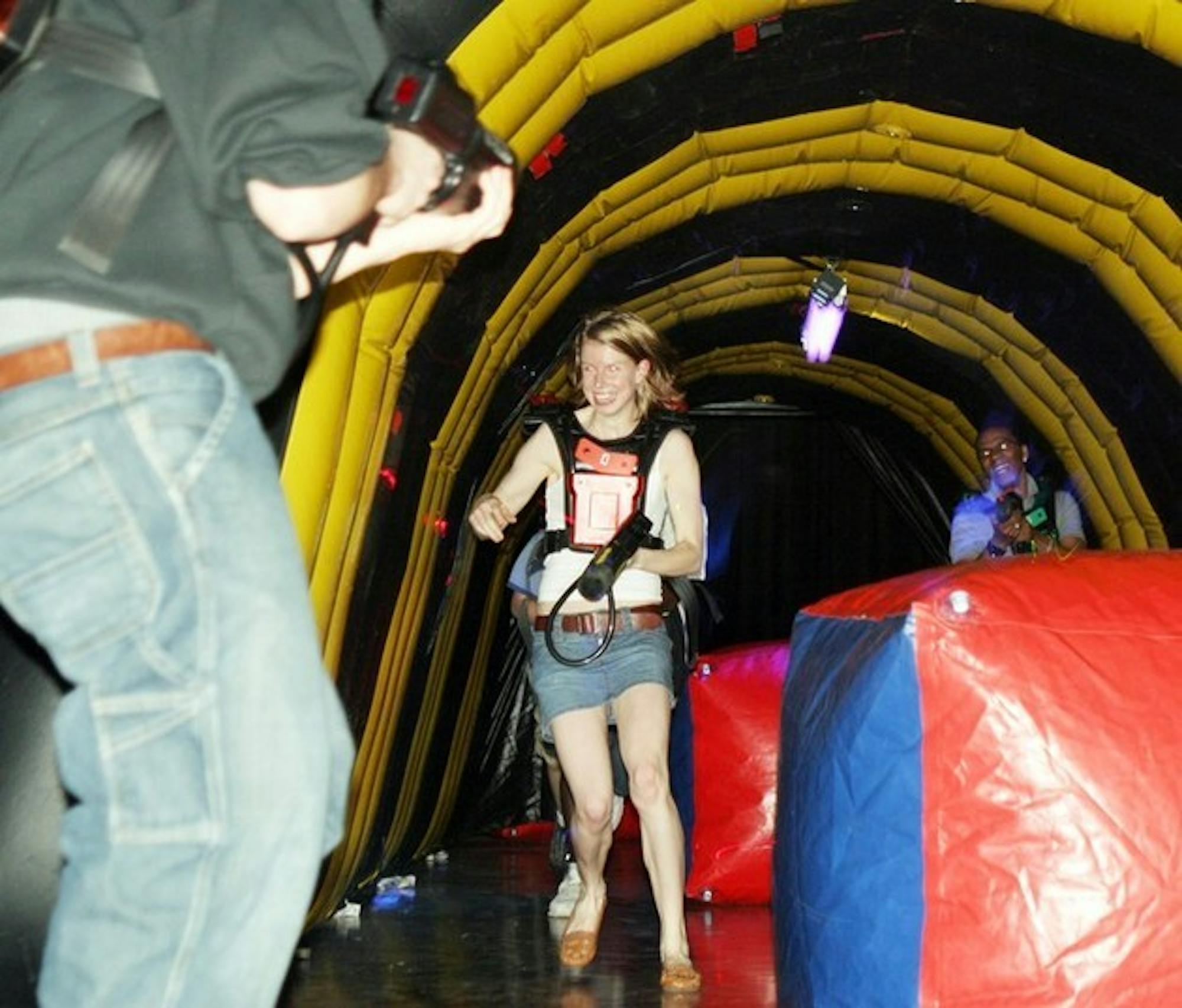 Jennifer Taylor '08 darts through a laser tag arena set up in Collis Commonground Saturday night. Lines could last 30 minutes long for the event.