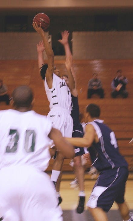 Alex Barnett '09 soars above the rim in the Big Green's loss to UNH.
