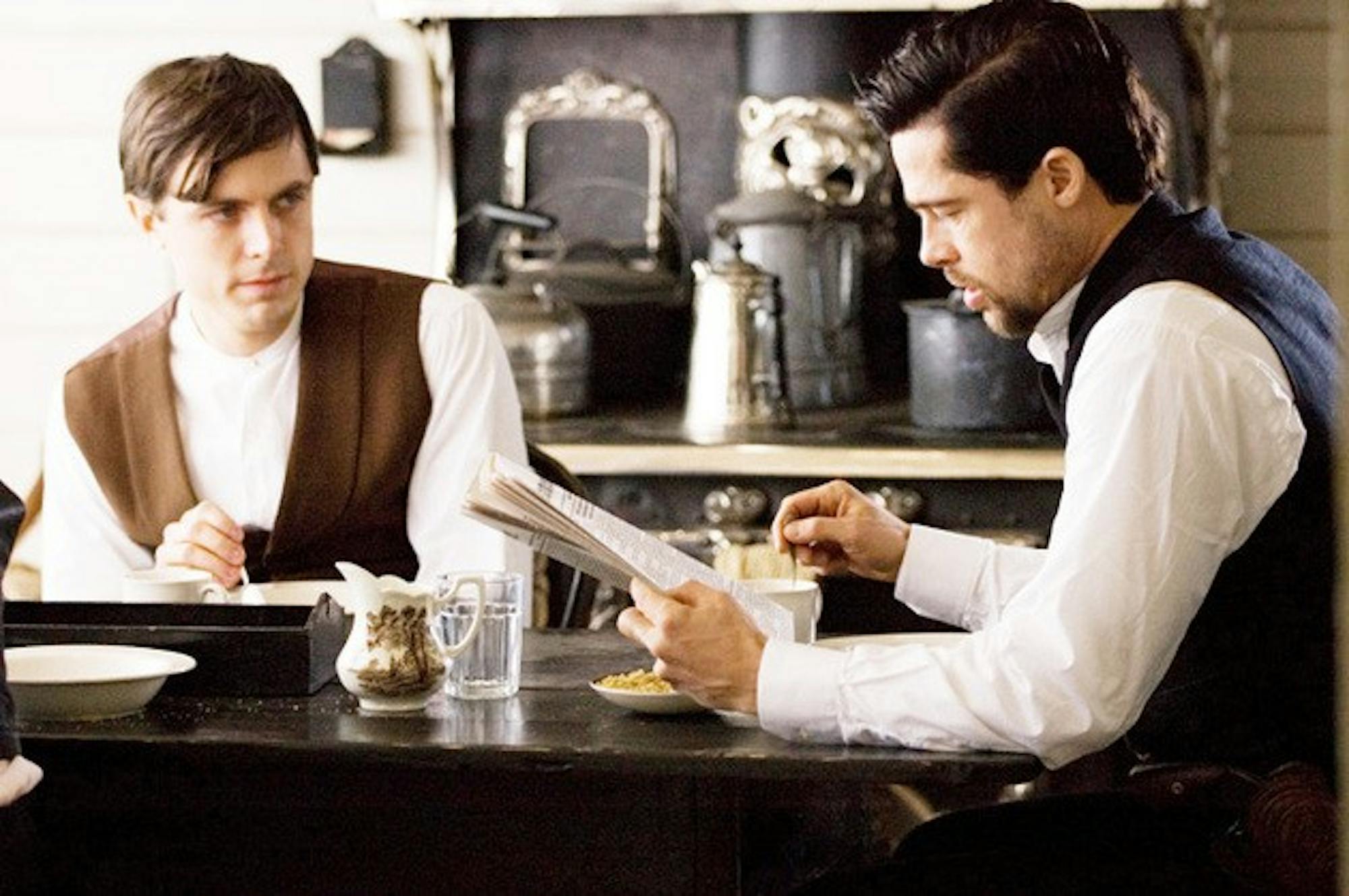 CASEY AFFLECK as Robert Ford and BRAD PITT as Jesse James in Warner Bros. Pictures