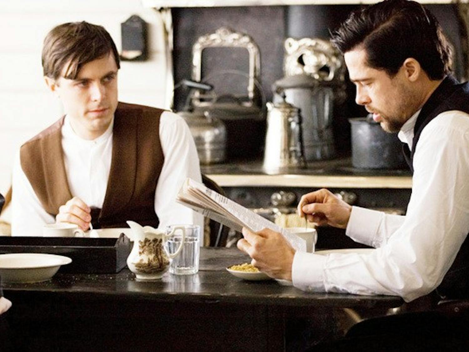 CASEY AFFLECK as Robert Ford and BRAD PITT as Jesse James in Warner Bros. Pictures