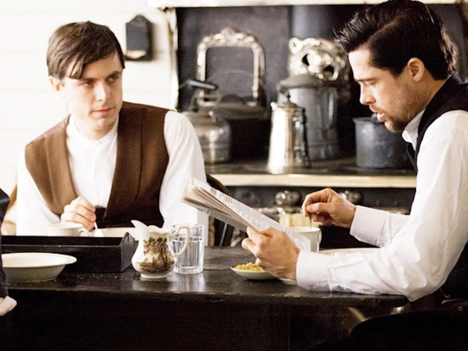 CASEY AFFLECK as Robert Ford and BRAD PITT as Jesse James in Warner Bros. Pictures