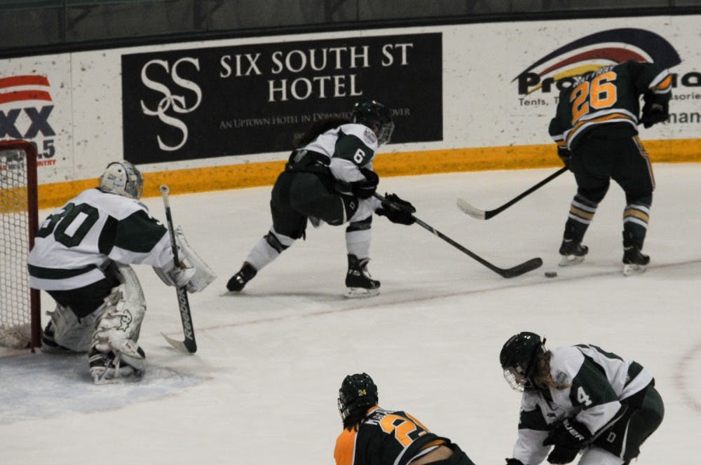 2.24.14.sports.womenspuck