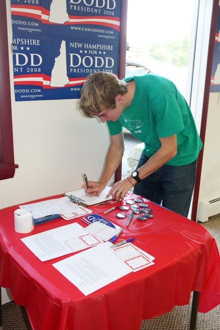 Zach Mayer '08 signs in at the local office opening for presidential hopeful Sen. Chris Dodd, D-Conn., in West Lebanon on Friday, Sept. 21.