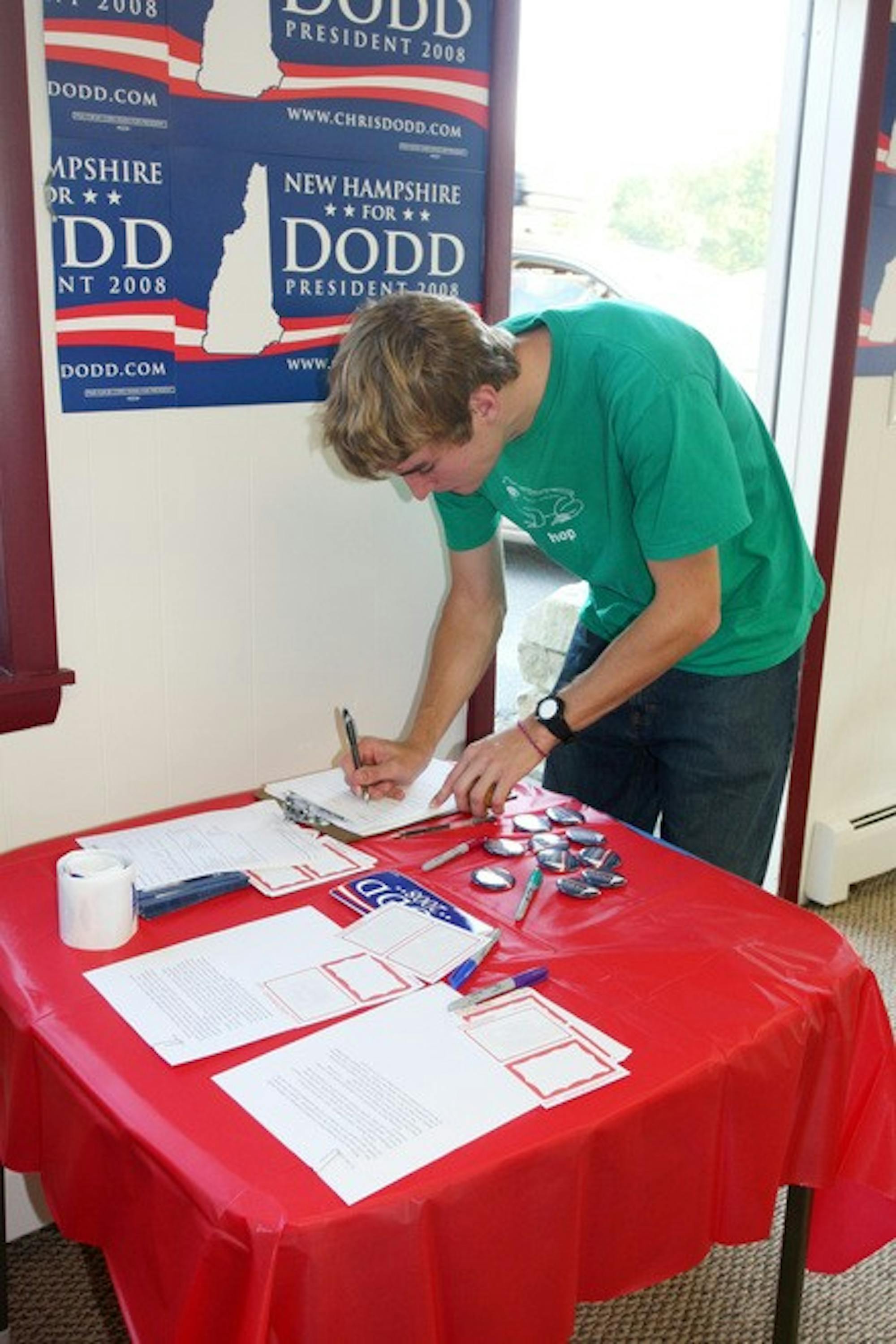 Zach Mayer '08 signs in at the local office opening for presidential hopeful Sen. Chris Dodd, D-Conn., in West Lebanon on Friday, Sept. 21.