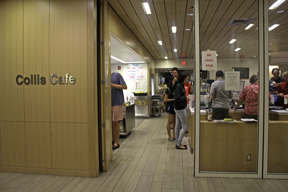 Cashiers keep an eye on students at Collis late night, where entry is now restricted to one side.