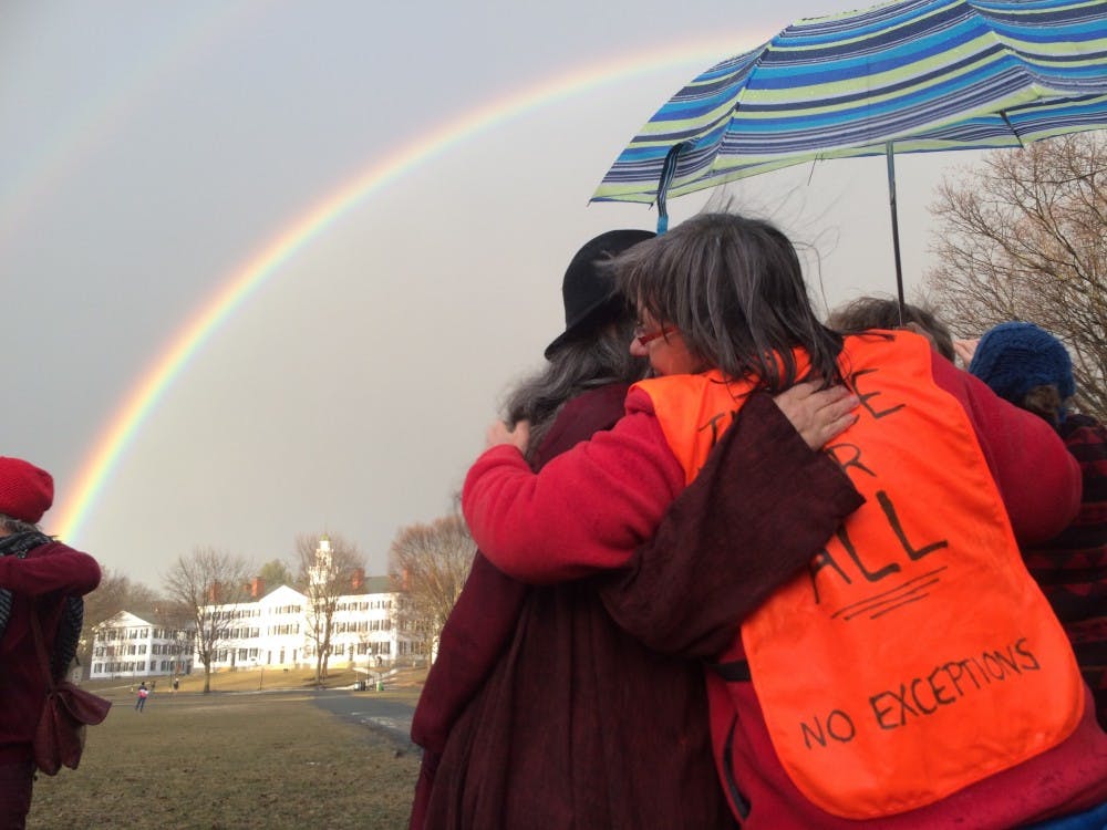 As the rain dissipated, a&nbsp;rainbow appeared, arching over the Green and the demonstrators.