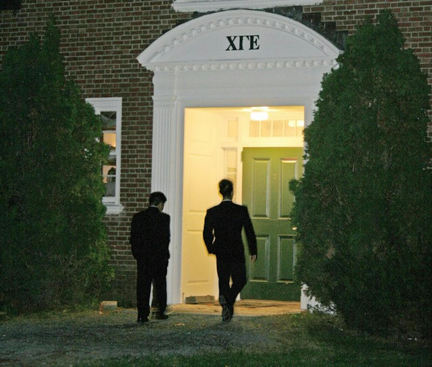 Two men attend rush Sunday evening at Chi Gamma Epsilon fraternity. Estimates so far show a higher number of rushees this year compared to last year.