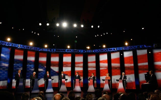 The other seven Democratic candidates listen to Sen. Joe Biden of Delaware respond to a question from NBC anchor Tim Russert in Spaulding Auditorium.
