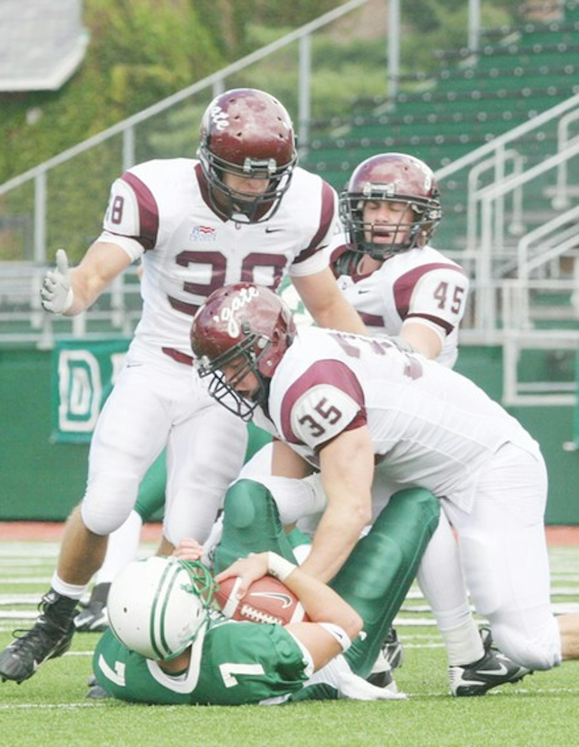 Quarterback Tom Bennewitz '08 threw for two touchdowns in the first half only to see a 28-0 lead disappear.