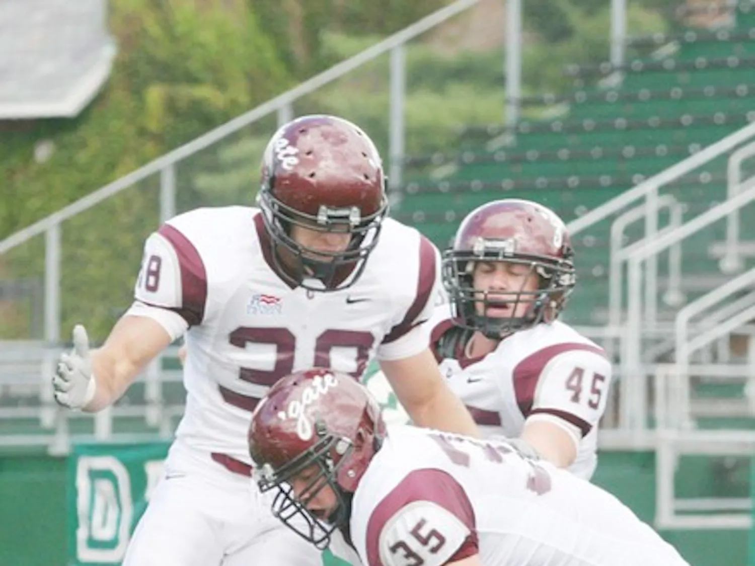 Quarterback Tom Bennewitz '08 threw for two touchdowns in the first half only to see a 28-0 lead disappear.
