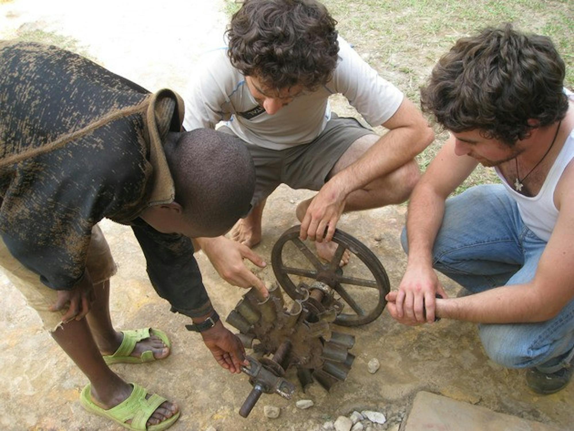 Members of Dartmouth Humanitarian Engineering work on a project to expand hydroelectric power in Rwanda.