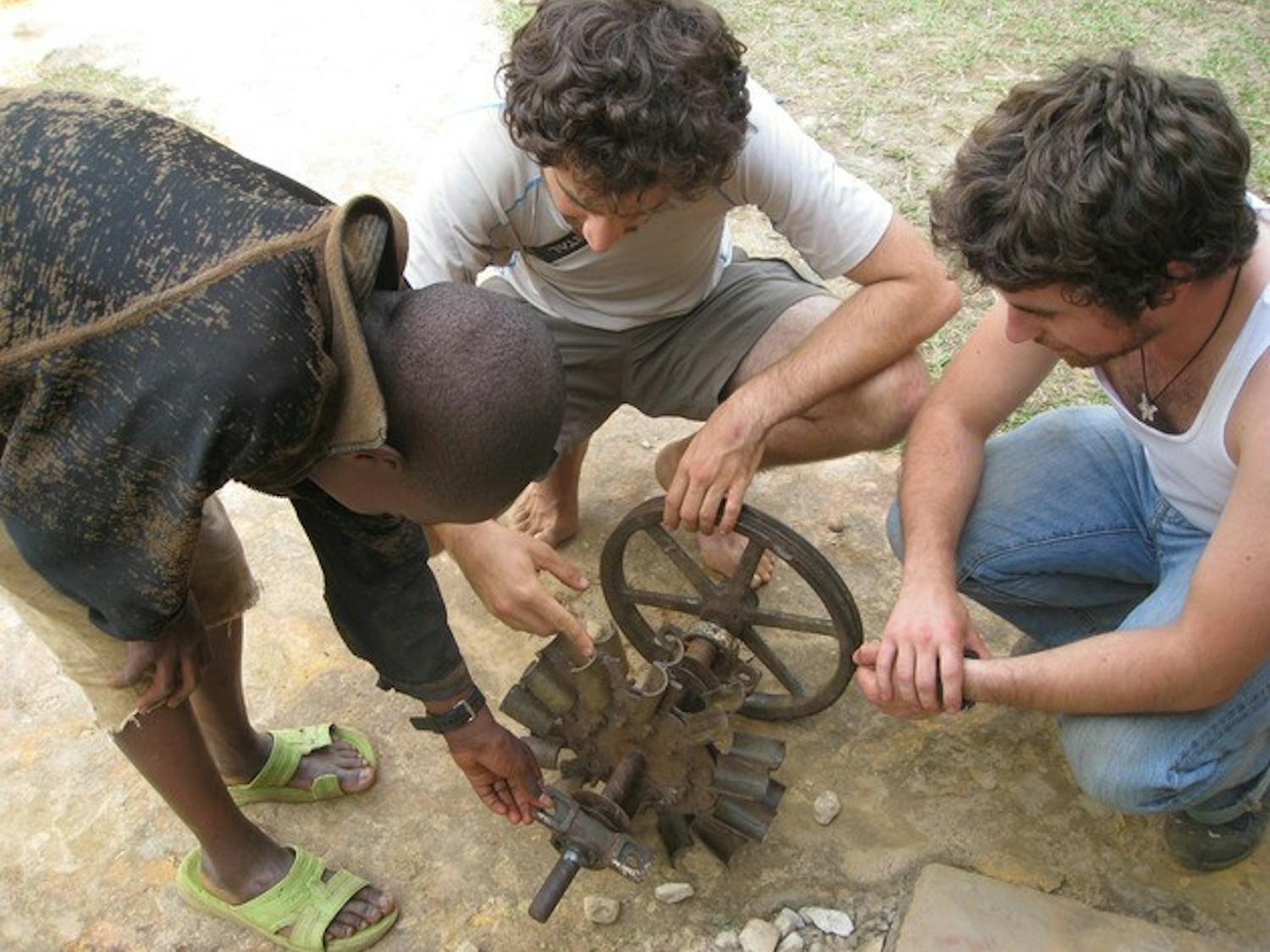 Members of Dartmouth Humanitarian Engineering work on a project to expand hydroelectric power in Rwanda.